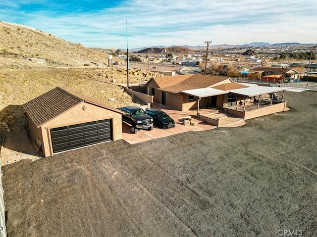 drone / aerial view featuring a mountain view