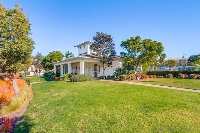 view of front of home featuring a porch and a front lawn