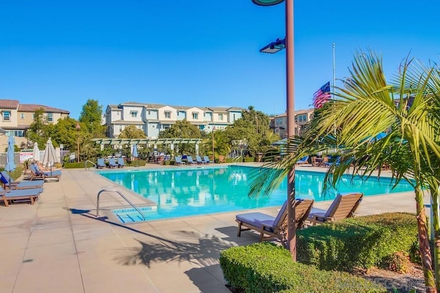 view of swimming pool with a pergola and a patio area