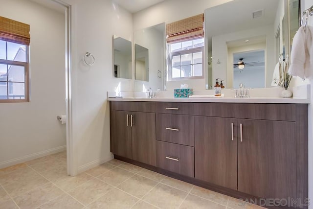 bathroom featuring ceiling fan, vanity, tile patterned flooring, and plenty of natural light