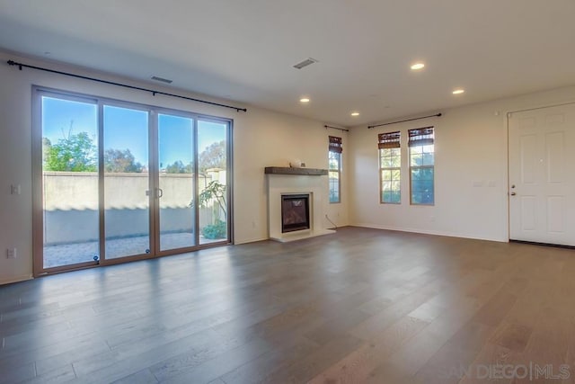 unfurnished living room featuring hardwood / wood-style floors