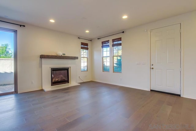 unfurnished living room with hardwood / wood-style flooring