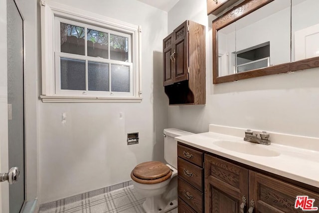 bathroom with toilet and vanity