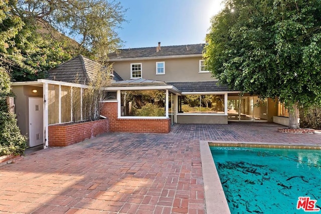 rear view of property with a patio