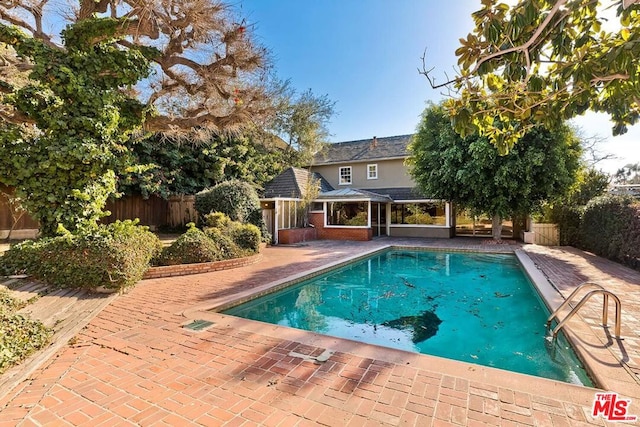 view of pool featuring a patio area