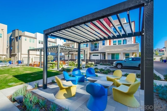 view of home's community with a yard and a pergola