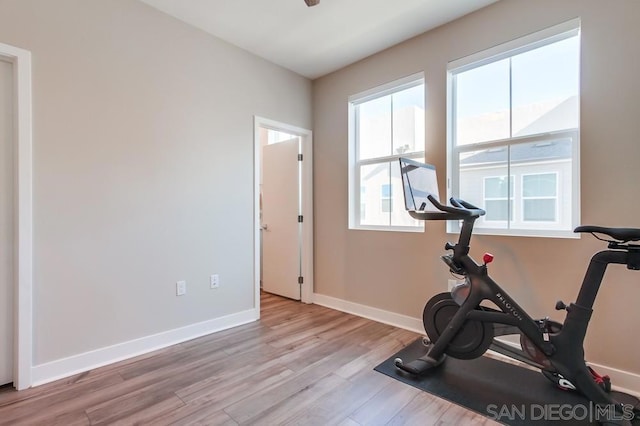 exercise area with light wood-type flooring