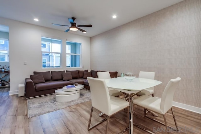 dining room featuring ceiling fan and light hardwood / wood-style flooring