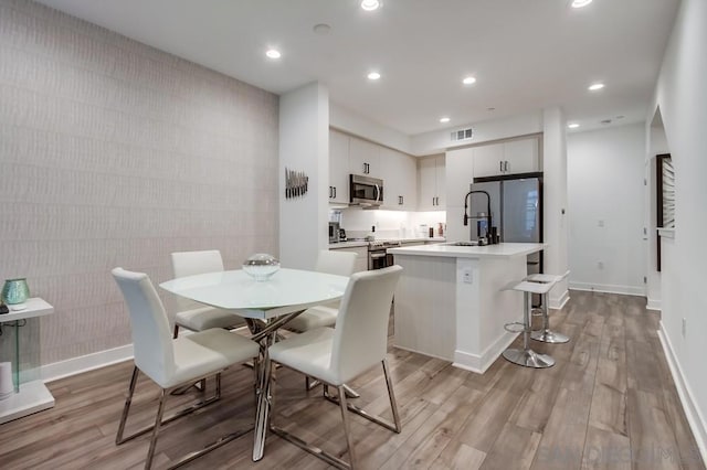 dining area featuring light hardwood / wood-style flooring