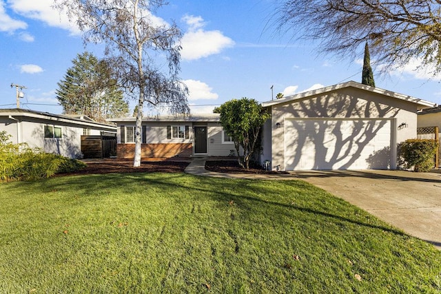 view of front facade with a front yard and a garage