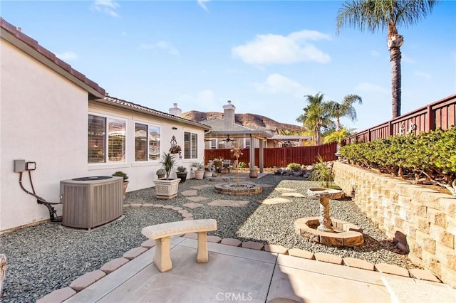 exterior space with a patio area and central AC