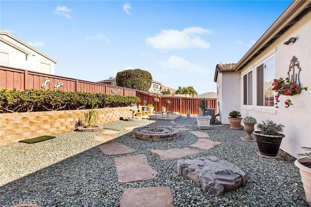 view of yard with a patio area and a fire pit