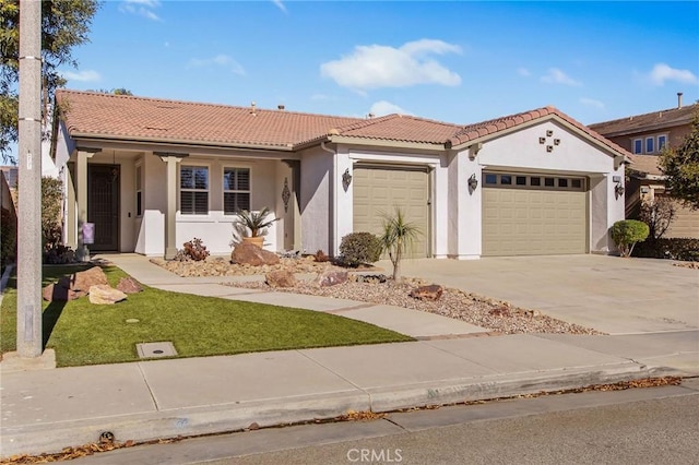 mediterranean / spanish-style home with a garage