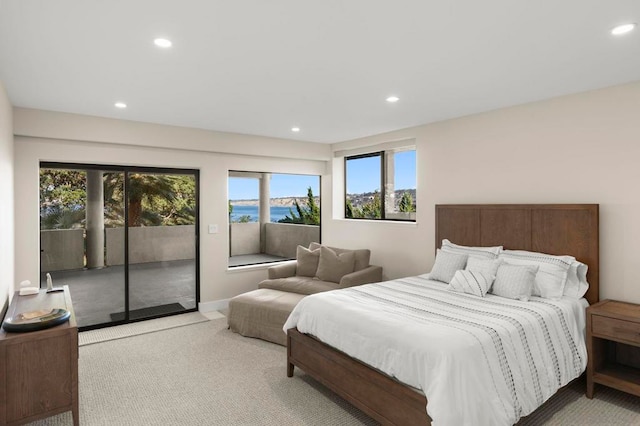 bedroom featuring light carpet and access to exterior