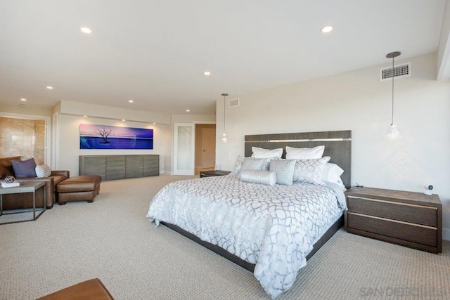 bedroom featuring light colored carpet