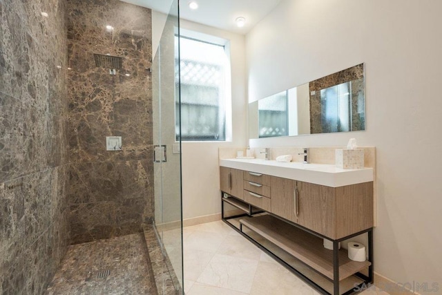 bathroom featuring vanity and walk in shower