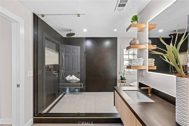 interior space with vanity and walk in shower