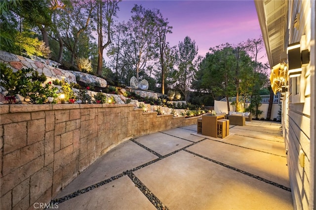 view of patio terrace at dusk