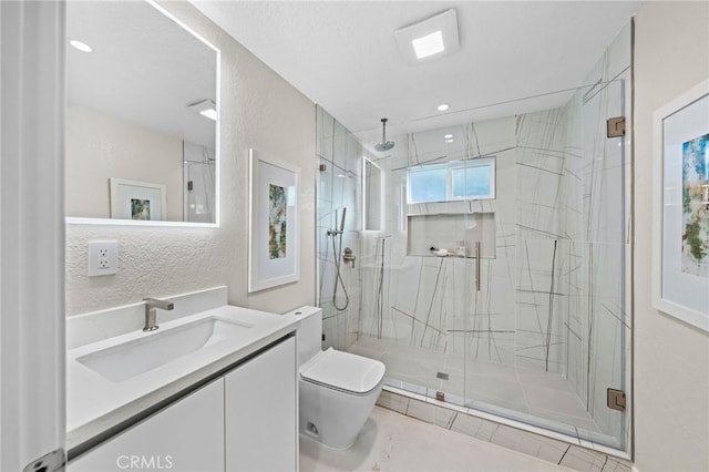 bathroom featuring toilet, vanity, tile patterned flooring, and a shower with shower door