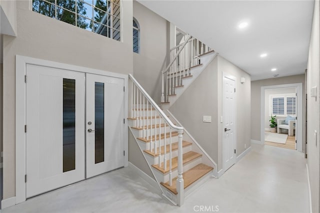 stairs with french doors