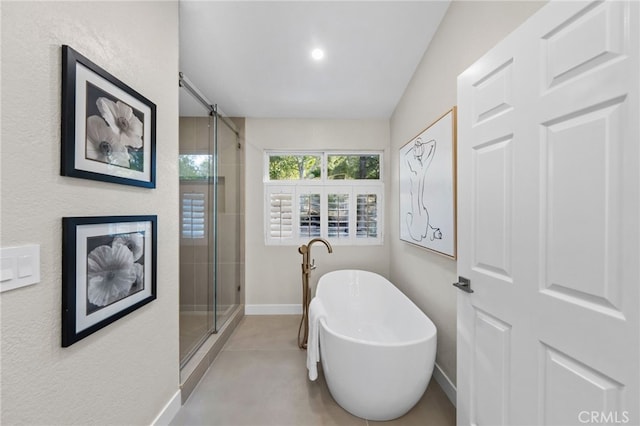 bathroom featuring independent shower and bath