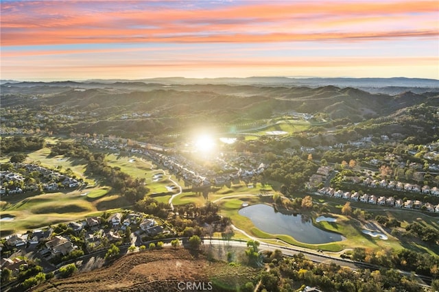 aerial view at dusk with a water and mountain view