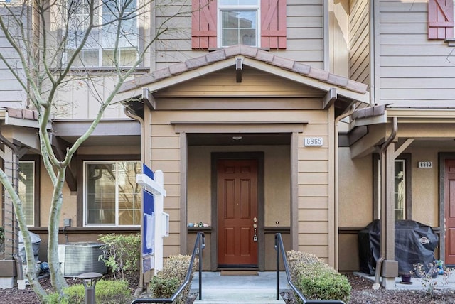 entrance to property featuring central AC