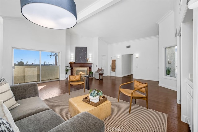 living room with beam ceiling, crown molding, high vaulted ceiling, and dark hardwood / wood-style floors