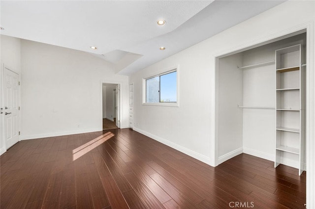 unfurnished bedroom with dark hardwood / wood-style floors