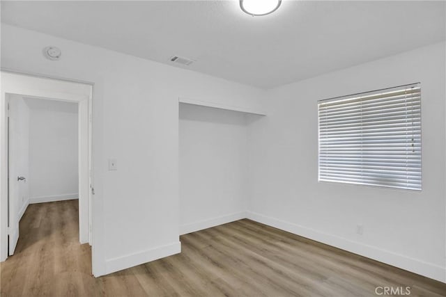 unfurnished room featuring light hardwood / wood-style floors