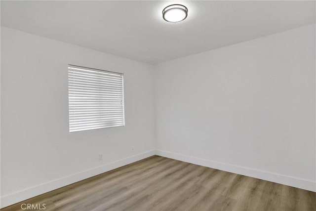 empty room with light hardwood / wood-style floors