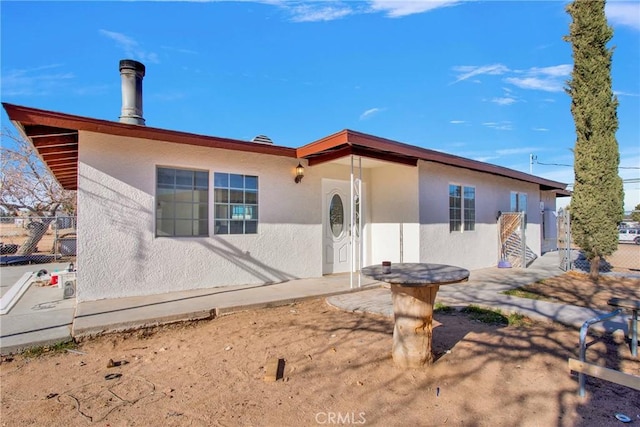 view of front of home featuring a patio