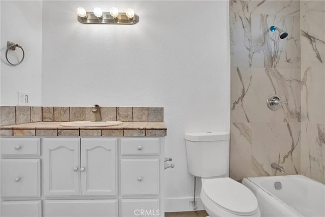 full bathroom featuring toilet, vanity, and tiled shower / bath combo