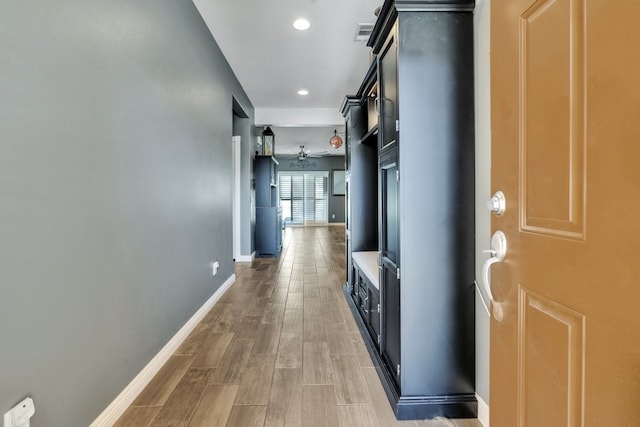 corridor featuring wood-type flooring