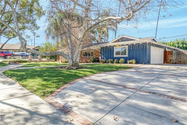 single story home with a front yard and a garage