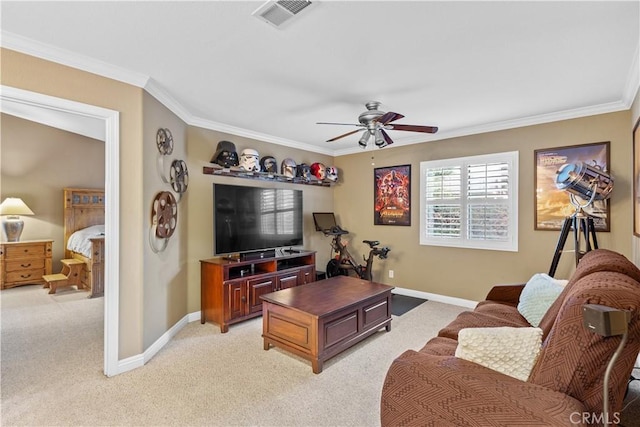 carpeted living room featuring ceiling fan and crown molding