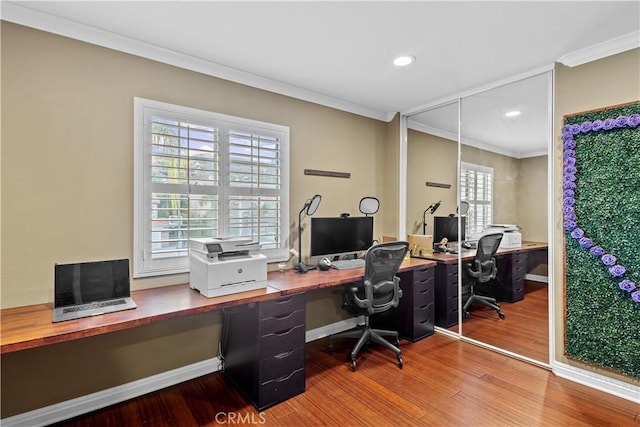 office area with ornamental molding and hardwood / wood-style floors