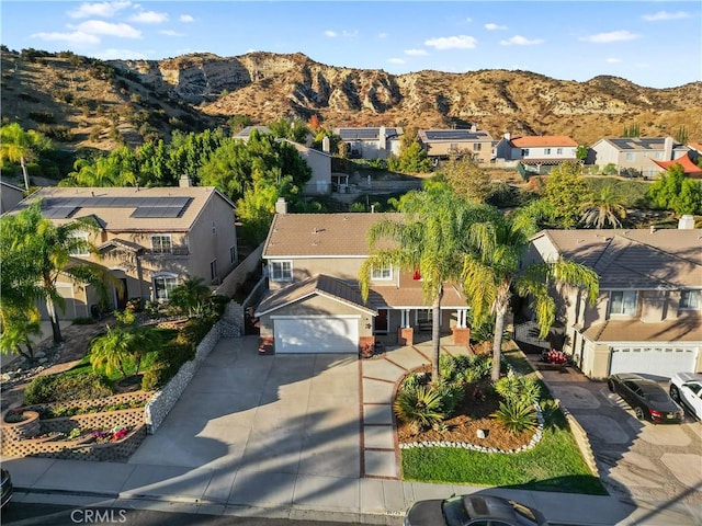 birds eye view of property featuring a mountain view