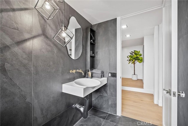 bathroom with hardwood / wood-style flooring and sink