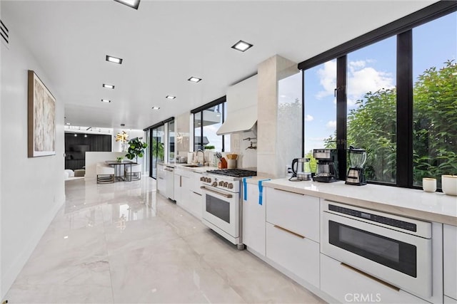 kitchen featuring white cabinetry, sink, and white appliances