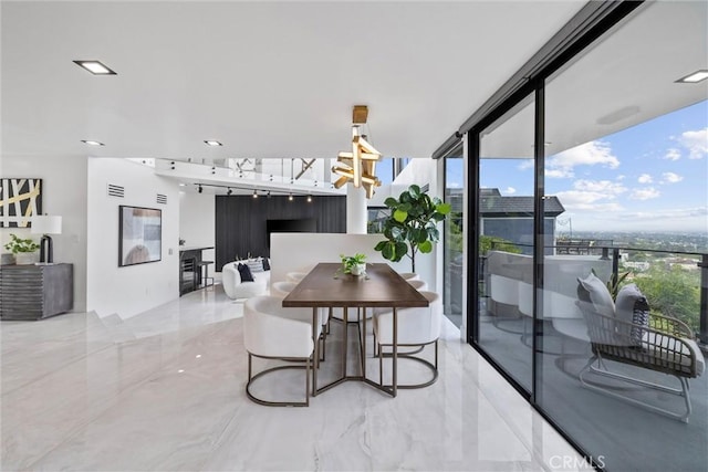 dining space with expansive windows