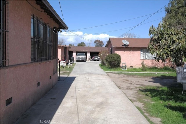 2147 E 119th St, Los Angeles, CA 90059 - view of side of property featuring crawl space and stucco siding