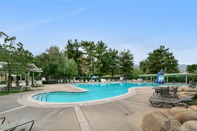 view of swimming pool featuring a patio