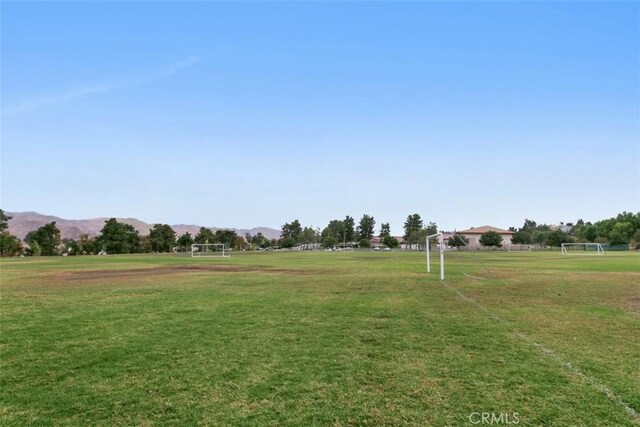 surrounding community with a rural view and a mountain view