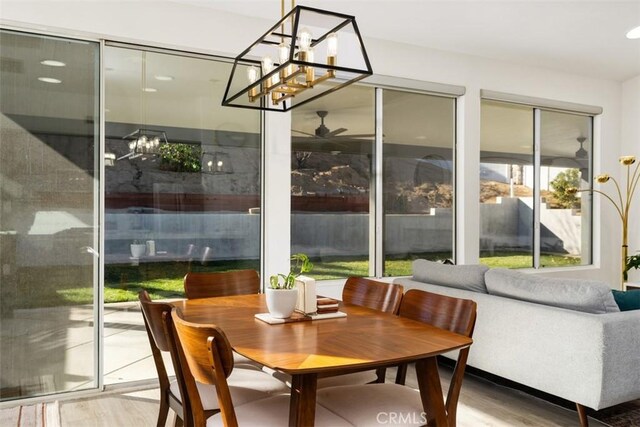 sunroom / solarium with ceiling fan