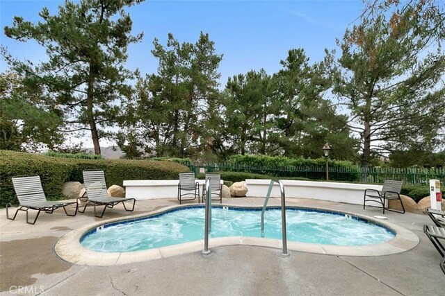 view of pool featuring a patio