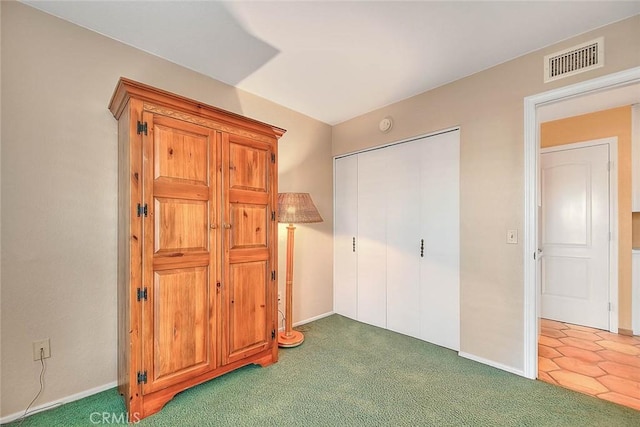 carpeted bedroom featuring a closet