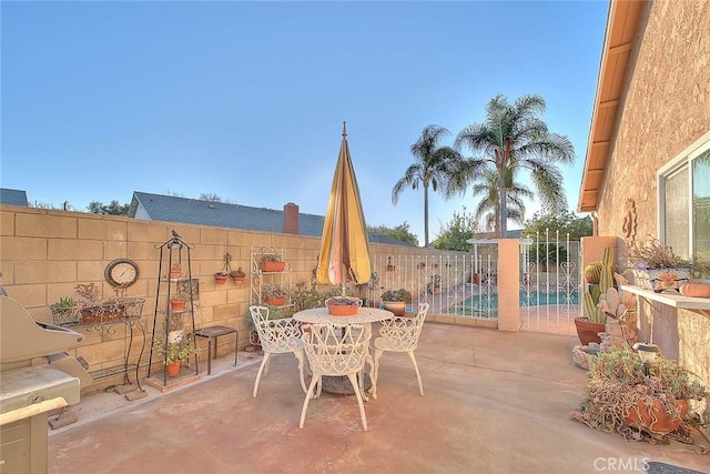 view of patio featuring a fenced in pool