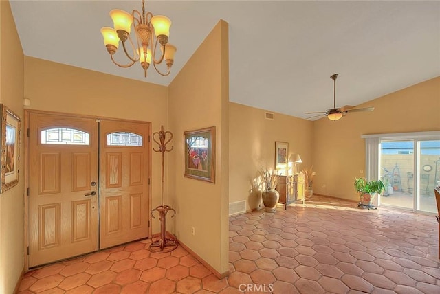 foyer featuring vaulted ceiling and ceiling fan with notable chandelier