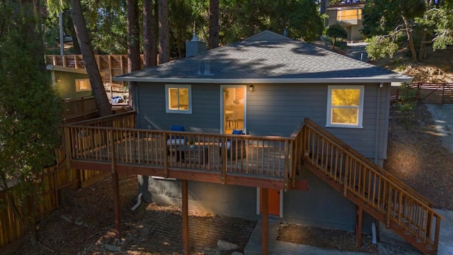 back of house featuring a deck